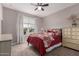 Cozy bedroom with a ceiling fan, natural light, and neutral color, creating a peaceful atmosphere at 17017 N Palo Azul Rd, Maricopa, AZ 85138