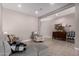 Inviting living room with a cozy sectional, accent chair, and stylish decor at 17017 N Palo Azul Rd, Maricopa, AZ 85138