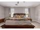 Warm main bedroom featuring plush bedding and a relaxing atmosphere at 17017 N Palo Azul Rd, Maricopa, AZ 85138