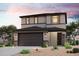Charming two-story home featuring a modern design, desert landscaping, and a two-car garage at 17260 W Daley Ln, Surprise, AZ 85387