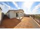 View of the backyard featuring a covered patio and ample space at 17266 W Daley Ln, Surprise, AZ 85387