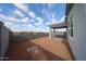 Wide angle of backyard with a view of the covered patio at 17266 W Daley Ln, Surprise, AZ 85387
