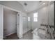 Modern bathroom featuring double sinks, granite countertops, and a glass-enclosed shower at 17266 W Daley Ln, Surprise, AZ 85387