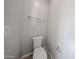 Small bathroom with neutral walls, tile floor, and a standard white toilet at 17266 W Daley Ln, Surprise, AZ 85387