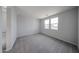 Bright bedroom features plush carpet and double windows for lots of natural light at 17266 W Daley Ln, Surprise, AZ 85387
