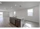 Kitchen island with granite countertop, stainless steel dishwasher and faucet at 17266 W Daley Ln, Surprise, AZ 85387