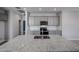 Kitchen island features granite countertops, cabinets and recessed lights above at 17266 W Daley Ln, Surprise, AZ 85387