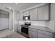 The kitchen area with sleek, stainless steel appliances and recessed lights at 17266 W Daley Ln, Surprise, AZ 85387