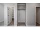 Bright laundry room with modern cabinets, tiled floors, and washer and dryer hookups for convenience at 17266 W Daley Ln, Surprise, AZ 85387
