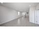 Bright living room shows recessed lights, and tiled floors throughout at 17266 W Daley Ln, Surprise, AZ 85387