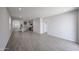 Bright living room features recessed lights and grey tile flooring at 17266 W Daley Ln, Surprise, AZ 85387