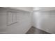 Walk-in closet with neutral walls, carpet, and hanging rack for ample storage at 17266 W Daley Ln, Surprise, AZ 85387