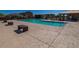 Community pool area with clear blue water for leisure and recreation under the sun at 17289 W Daley Ln, Surprise, AZ 85387