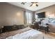 Neutral bedroom with a window, tv and ceiling fan at 1785 S 222Nd Ln, Buckeye, AZ 85326