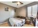 Neutral colored bedroom featuring grey walls, a window, and ceiling fan at 1785 S 222Nd Ln, Buckeye, AZ 85326
