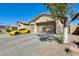 Home featuring a long driveway leading to a two-car garage, offering ample parking space at 1785 S 222Nd Ln, Buckeye, AZ 85326