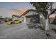 Beautiful exterior view of a home showcasing a three-car garage and extra-wide driveway, perfect for car enthusiasts at 1785 S 222Nd Ln, Buckeye, AZ 85326
