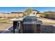 Outdoor kitchen with stainless steel grill, countertop space, and brick accents at 1785 S 222Nd Ln, Buckeye, AZ 85326