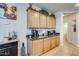 Charming kitchen view featuring a coffee bar, and ample natural light at 1785 S 222Nd Ln, Buckeye, AZ 85326