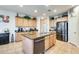 Spacious kitchen island and stainless appliances offer plenty of room for cooking and entertaining at 1785 S 222Nd Ln, Buckeye, AZ 85326