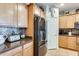 Well-equipped kitchen with stainless steel appliances and wooden cabinetry at 1785 S 222Nd Ln, Buckeye, AZ 85326