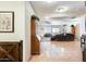 Open-concept living area with tiled flooring and comfortable seating, perfect for relaxation and entertainment at 1785 S 222Nd Ln, Buckeye, AZ 85326
