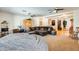 Spacious living room features a comfortable sectional couch, open floorplan and neutral color palette at 1785 S 222Nd Ln, Buckeye, AZ 85326