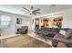 Inviting living room featuring a large sofa, fireplace, and open layout at 1785 S 222Nd Ln, Buckeye, AZ 85326