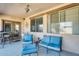Relaxing covered patio offers comfortable seating and a ceiling fan for warm days at 1785 S 222Nd Ln, Buckeye, AZ 85326