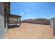 Spacious backyard with block wall, providing privacy and ample space for outdoor activities at 18243 W Daley Ln, Surprise, AZ 85387