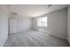 Carpeted bedroom with a large window for natural light at 18243 W Daley Ln, Surprise, AZ 85387
