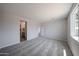 Carpeted bedroom with attached bathroom at 18243 W Daley Ln, Surprise, AZ 85387
