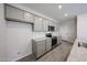 Well-equipped kitchen featuring granite counters, modern appliances, and ample cabinet space at 18243 W Daley Ln, Surprise, AZ 85387