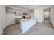 Modern kitchen with granite countertops, stainless steel appliances, and a center island at 18243 W Daley Ln, Surprise, AZ 85387
