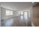 Spacious living room featuring tile flooring and sliding glass doors to the backyard at 18243 W Daley Ln, Surprise, AZ 85387