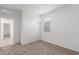 Bedroom featuring neutral walls and carpet and a closet with sliding doors at 2008 S 242Nd Ave, Buckeye, AZ 85326