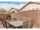 Backyard patio area showcases outdoor dining with block wall adding privacy at 2025 N 106Th Dr, Avondale, AZ 85392