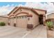 Charming single-story home with a two-car garage and low-maintenance desert landscaping at 2025 N 106Th Dr, Avondale, AZ 85392