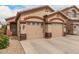 Inviting single-story home with a two-car garage and xeriscaped front yard at 2025 N 106Th Dr, Avondale, AZ 85392