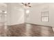 Bright and spacious living room featuring wood-like floors and ample natural light at 2025 N 106Th Dr, Avondale, AZ 85392
