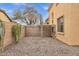 A fenced dog run area in backyard with low maintenance desert landscaping and direct access to the home at 2280 E Aloe Pl, Chandler, AZ 85286