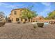 Large backyard featuring a swimming pool with rock waterfall and lush landscaping at 2280 E Aloe Pl, Chandler, AZ 85286