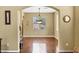 Elegant dining room with hardwood floors, chandelier, and plenty of natural light at 2280 E Aloe Pl, Chandler, AZ 85286