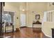 Elegant foyer with hardwood floors, high ceilings, and staircase leading to the upper level at 2280 E Aloe Pl, Chandler, AZ 85286