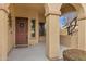 Covered front porch with decorative columns, stylish front door, and welcoming ambiance at 2280 E Aloe Pl, Chandler, AZ 85286