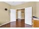 Open hallway showcases hardwood floors and views of additional rooms at 2280 E Aloe Pl, Chandler, AZ 85286
