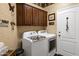 Functional laundry room with modern washer and dryer units at 2280 E Aloe Pl, Chandler, AZ 85286