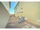 The backyard features a playset, desert landscaping and neutral stucco walls at 2315 N 73Rd Dr, Phoenix, AZ 85035