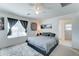 Bright bedroom showcasing a plush bed, ceiling fan and contemporary decor at 2315 N 73Rd Dr, Phoenix, AZ 85035