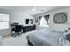 Bright bedroom featuring a workstation, mounted TV and plush bedding at 2315 N 73Rd Dr, Phoenix, AZ 85035